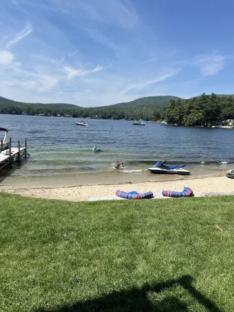 A quiet cove, the sunset and a sandy beach, on Lake Winnipesaukee