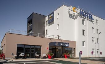 an exterior view of a hotel or motel with a large hotel sign above the entrance at Ace Hotel le Mans