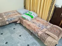 ROOM 9 Serene Retreat in Rawalpindi - Your Home Away from Home 1