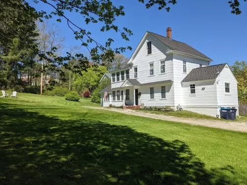 Enjoy comfortable elegance in this secluded grand home located in town