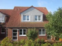 Comfortable holiday center house with its own garden directly at the nature reserve Hotels in Borkum