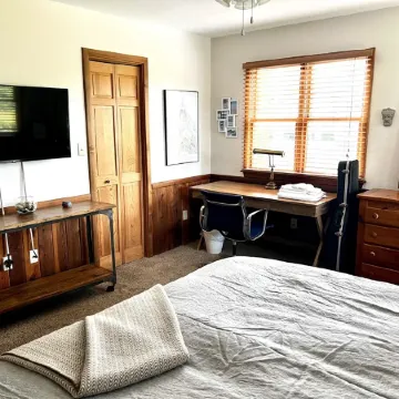 Three-bedroom house with views, decks, golf cart and home gym!