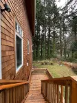 private hot tub, fun game room, cozy beach house
