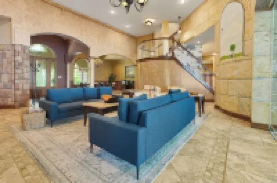 Stunning waterfront villa with indoor pool and kids swing set and play area.