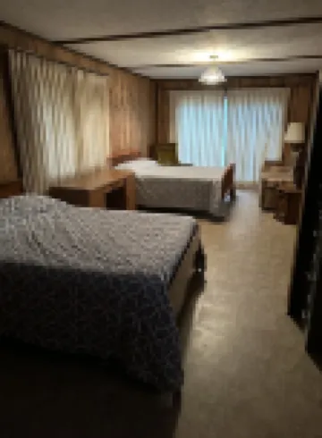 Cozy vacation home nestled in a quiet wooded area. Near town but private