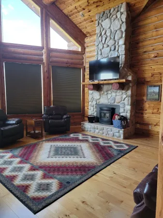 Large garage for bikes. Beautiful log home.  On golf course.