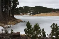A beautiful mountain lake setting located in the 'Heart of the Black Hills'