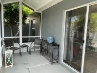 Charming Villa with Screened Lanai and Golf Cart - Cozy Oasis Retreat