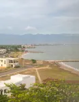 Gated 1-bedroom Condo in Portmore with AC, WiFi, Pool, Kitchen, TV, Beach View