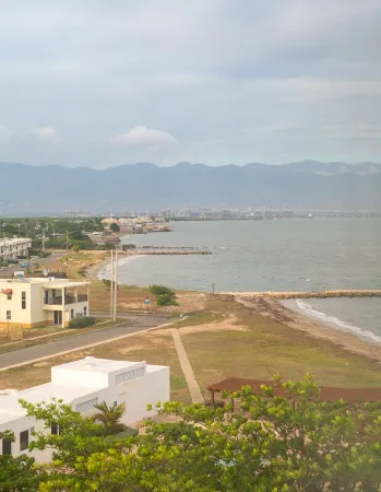 Gated 1-bedroom Condo in Portmore with AC, WiFi, Pool, Kitchen, TV, Beach View