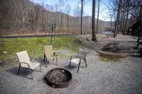 Fall Foliage Riverfront Cabin w/Hot Tub, King Bed, EV & Firepit & Mountain Views