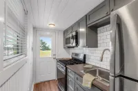 Charming Tiny House Retreat with Cozy Porch - Inviting Escape