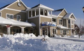 a snow - covered town with a large number of snow - covered buildings , some of which are covered in snow at Newport Resort