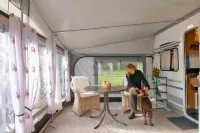 Chic caravan with awning on the Baltic Sea in Dierhagen
