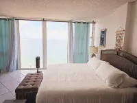 Lovely Beachfront Condo overlooking the Ocean, private jacuzzi, balcony & pool