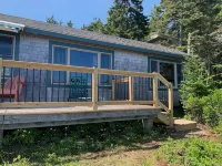 Sunrise Cottage. Relaxing waterfront deck on the rocky shore of Bailey Island.