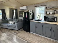 This tiny cabin is a peaceful place complete with stocked pond and kayaks!
