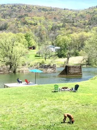 Kayak/Canoe/Fish & Relax right from the backyard of this Riverfront 3 B/R home!