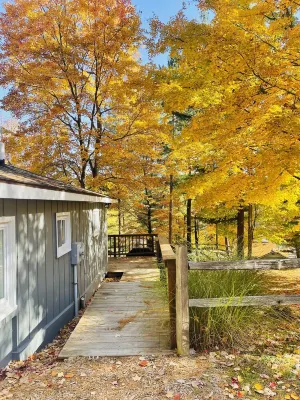 NEWLY RENOVATED! Large sandy beach & swim area. Cute 3 bedroom lake house
