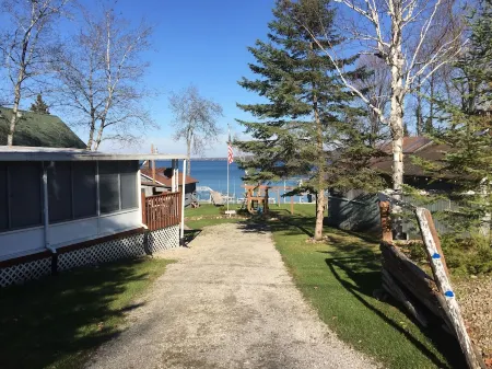 Vacation Stay at Hubbard Lake Air-Conditioned Lakefront Mobile Home