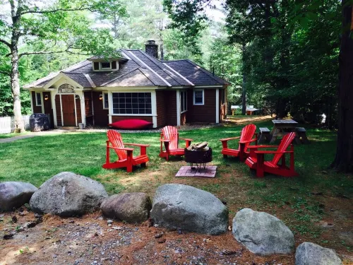 Short walk to village...with private wooded setting. EV Charger in parking area.