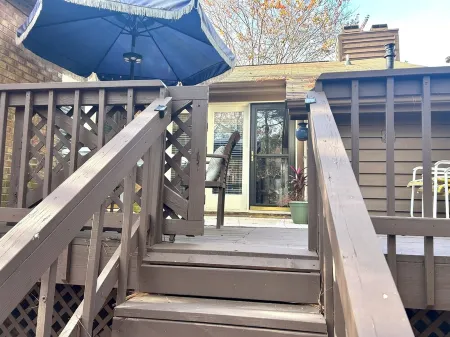 Cozy one level, 2 BR, 2 Bath TH in charming wooded community. Perfect location!