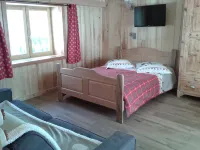 Typical Savoyard chalet with roof shingles, tufa walls and foist Hotel dekat ESF PLagne 1800