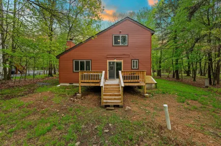 Lake Access and Expansive Deck - Charming Retreat with Cozy Fireplace