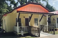Downtown by Chattahoochee River, sit on front porch as horse and buggy stroll by