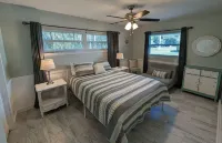 Waterfront Paradise w dock, large patio, lanai, pool, hot tub! Bring your boat!