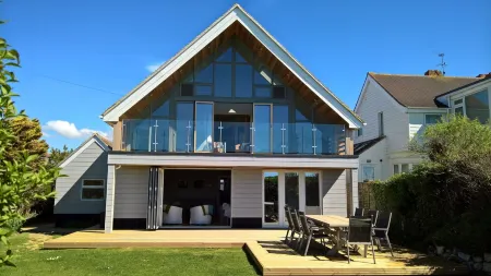 Beach Front Holiday Home on Private Road with Views Out to Sea. 100+  Reviews