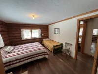 New!  Sleeps 15 Level lawn to lake.  Sandy beach.  Two docks. Great fishing.
