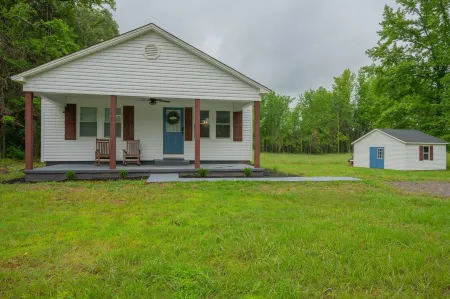 Cozy country home with a beautiful creek at the back of the property.