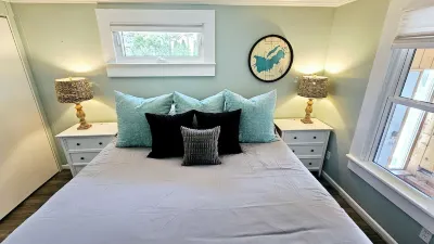 Lakefront cottage on Muskegon Lake! Fire pit, 40' BOAT DOCK, near beach, shops Hotels near Muskegon South Pierhead Lighthouse