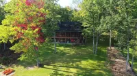 Tranquil Lakefront Log Cabin with Breathtaking Views.