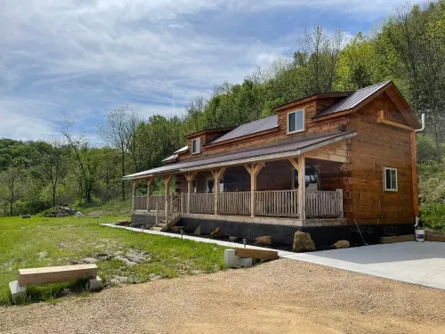 Cozy hillside retreat near trout stream, public forest and UTV trails.