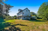 Dog-friendly riverfront retreat with hot tub on 5.2 acres near the beach