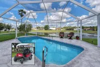 Premier home with Heated Pool, Waterfront, 2 king beds & 4 person golf cart.