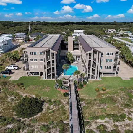 Newly Remodeled Oceanfront Condo with Salt Water Pool and Private Walkway to Beach by RedAwning