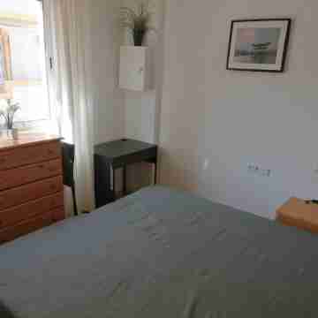 Spacious terraced house for up to six people with communal pool Rooms