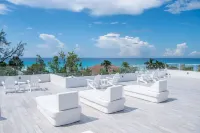 7 Mile Beach Beach Penthouse. Ocean views from Roof Terrace and a Pool Pavilion