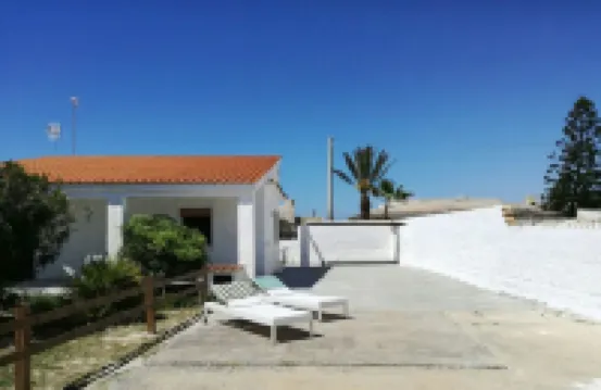 Villa at 20 m. from the sea on the beautiful and unspoiled beach of Carratois