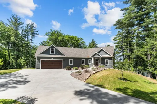 Family Friendly lake home, beach, level lot, fire pit, game room, dog friendly!