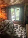 A Stream  runs through it. Comfy little cabin with a stream by your bedroom.