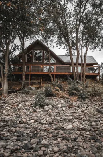 Mid-century modern cowboy retreat with a 35-ft. deck on the Salmon River.