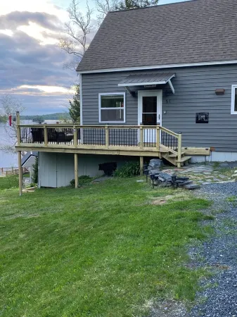 Beautiful lakefront camp with sunset view over big moose mountain