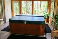 Lakeside cabin with Hot Tub and full kitchen!  Sleeps up to 12 people.