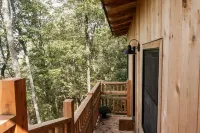 Japanese timberframe tiny house perched on side of Lookout Mountain