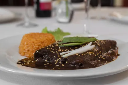 Capital O la Huerta Golf & Hotel Отели в г. Чолула де Ривадабия