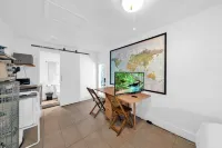 Stylish Kitchen and Lush Backyard Oasis - Modern Tropical Hotels in North Miami